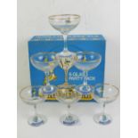 A set of six retro vintage Babycham glasses featuring the iconic Babycham deer with gilt rims over