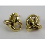 A pair of Russian knot style earrings, 9ct gold butterfly backs, no apparent marks on earrings, 0.