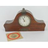 A mantle clock bearing Metropolitan Special Constabulary badge upon,