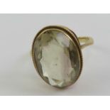 A 9ct gold citrine cocktail ring, the oval faceted stone approx 7.67ct (18 x 12 x 6.