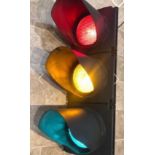 A full set of traffic lights having remote illumination control.