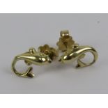 A pair of dolphin earrings, 14ct gold butterfly backs, no apparent hallmarks on earrings, 1.7g.