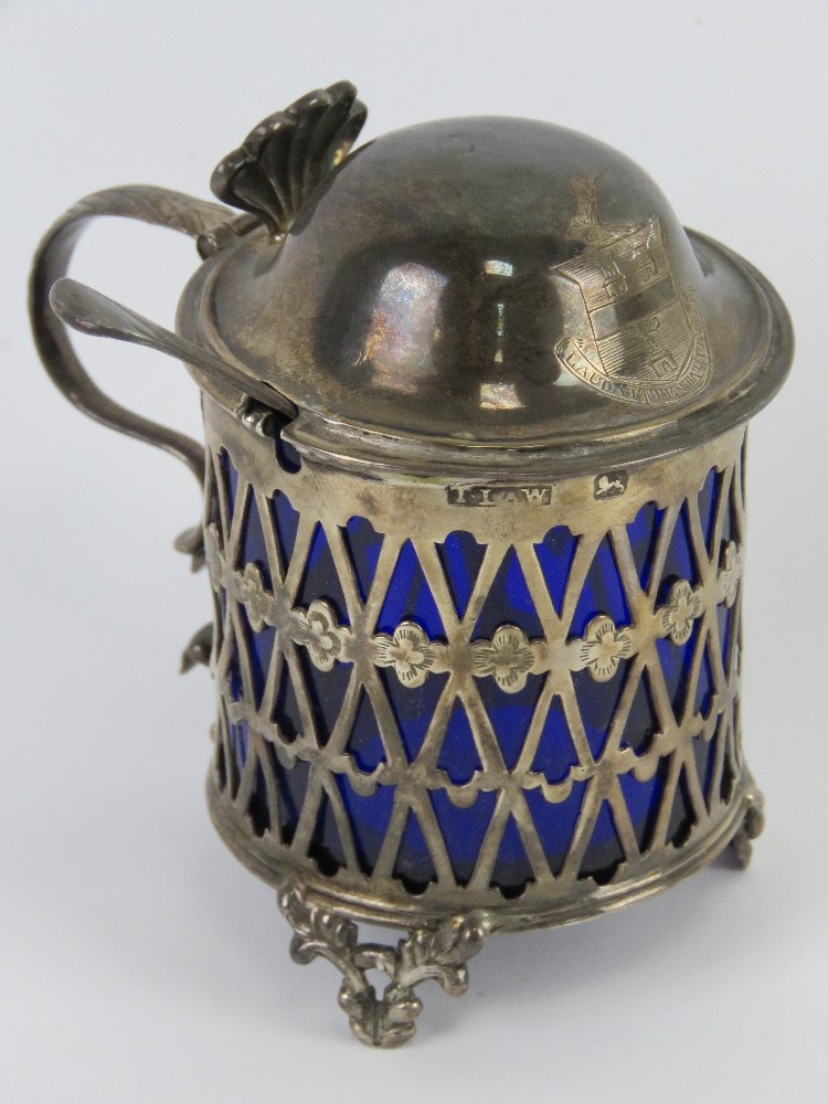 A George III silver mustard having pieced sides with Bristol blue glass liner,