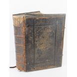 A leather bound bible with marginal reading and parallel references and the commentaries of Henry