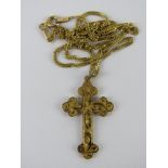 A 9ct gold crucifix on 9ct gold chain, pendant 3cm inc bale, chain 45cm in length. Total weight 2.