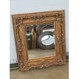 A large and impressive contemporary gold painted mirror, bevelled edge glass, 98 x 88cm.