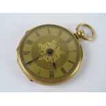 An 18ct gold ladies fob watch, open face with yellow metal dial and blued steel hands,