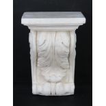 A contemporary plaster wall plinth in the classical style decorated with acanthus leaf measuring 17.