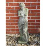 A pre-cast Classical style female partial nude statue, 86cm high.