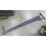 A vintage two person saw measuring 150cm in length