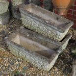 A set of three pre-cast stone planters having brickwork pattern upon, 66cm wide.