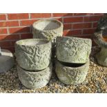 A set of six pre-cast stone planters having fruiting plant design upon, 29cm dia, 21.5cm high.