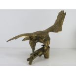 A large brass figurine of an eagle, wingspan approx 47cm.