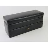 A black leatherette two tier watch box to hold twelve watches.