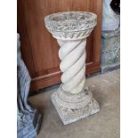 A pre-cast stone barleytwist bird bath, 57cm high.