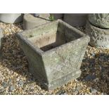 A pre-cast stone garden planter having latticework and mouse pattern upon, 35cm wide, 33cm high.