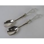 A pair of HM silver salad servers having cut glass handles, hallmarked Birmingham 1905.