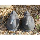 A pair of resin duck garden ornaments, each 28cm in length.