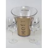 A plastic Moet & Chandon ice / champagne bucket with pair of Moet & Chandon glasses.