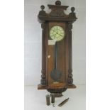 A Vienna 30 hour wall clock with weights and pendulum, enamel dial, for simple restoration.