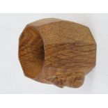 A Robert Mouseman Thompson oak napkin ring, carved with signature mouse.