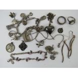 A quantity of assorted silevr and white metal jewellery including a charm bracelet, 74.1g.
