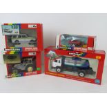 Four Britains vehicles in boxes; Police Land Rover Discovery, Milk Marque Tanker, Mini Trailer,