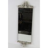 A contemporary hall mirror having silver painted decoration to top and bottom 66 x 21.