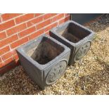 A pair of dark grey painted planters having galleon type masted sailing ships upon,