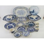 Blue and white ceramics including tea strainer, coffee cups,