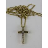 A yellow metal crucifix on 9ct gold chain, 2.2g.