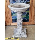 A pre-cast birdbath having ivy and mouse decoration to the column, 73cm high.