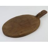 A Robert Mouseman Thompson oak cheeseboard, carved with signature mouse, 39 x 20.