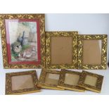 A set of matching gilt leaf design frames, various sizes,