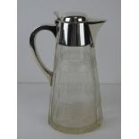 A HM silver lidded cut glass water jug or carafe, Birmingham 1919, 24cm high,