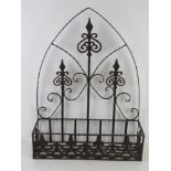 An ironwork wall hanging Gothic style arched back plant holder, 48.5cm wide.