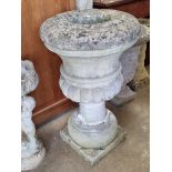 A large pre-cast stone planter, a/f, 77cm high.