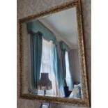 A contemporary gilded framed bevelled edge mirror, 130 x 100cm.