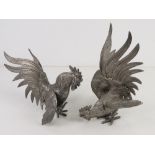 A pair of silver plated table centrepiece fighting cockerels