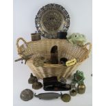 A twin handled wicker basket and containing a quantity of items including veteran series weighing