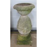 A pre-cast stone bird bath standing approx 104cm high.