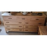 An oak chest of three short drawers over three pairs of long drawers, 174 x 46 x 88cm.
