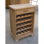 A pine wine rack having single drawer over, 60 x 37 x 88.5cm.