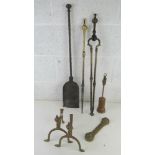 A large brass fireside companion set comprising poker and tongs with associated shovel and other