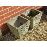 A pair of pre-cast planters having brickwork pattern upon, each 30cm wide x 29cm high.