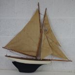 A vintage model sailboat bearing plaque Clyde Model Dockyard & Engine Depot Argill Arcade,