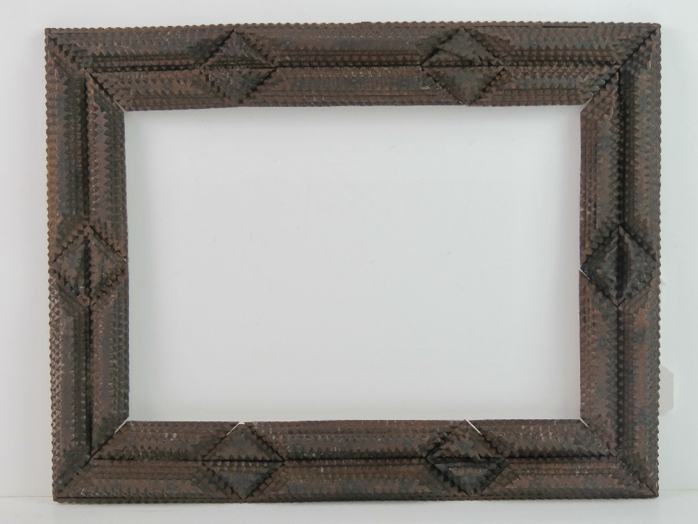 Folk Art / Tramp Art frame - an unusual circa 1900 hand carved multi sectional stained pine picture