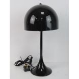A retro 1970's style table lamp with shade.