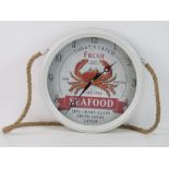 A restaurant style wall clock 'Todays Catch Fresh Seafood'