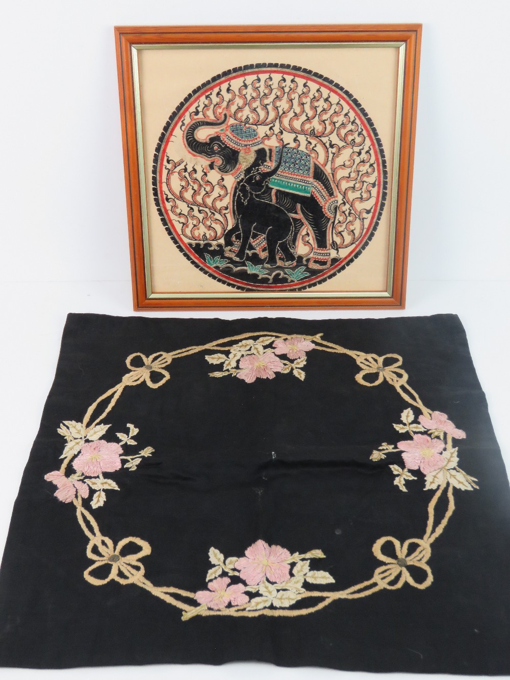 A framed Indo Asian pierced and part gilded decorative textile piece, 28cm dia, in frame.